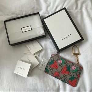 Gucci key case with Gucci Strawberry Print